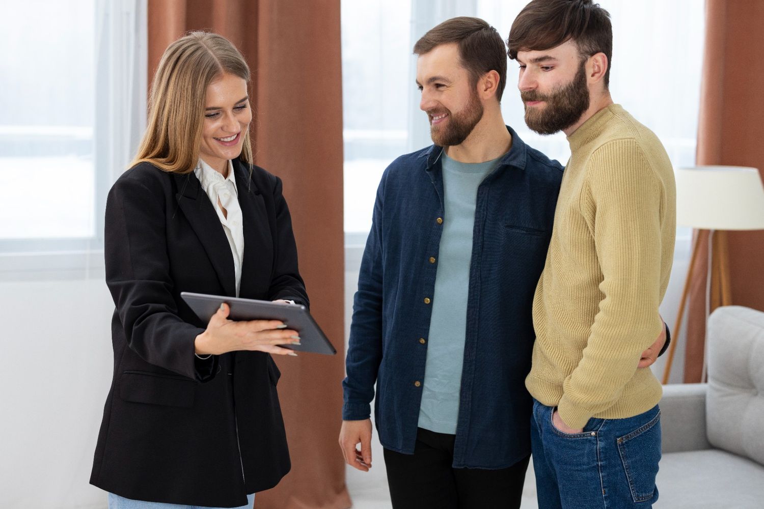 Real estate agent showing an apartment to a couple