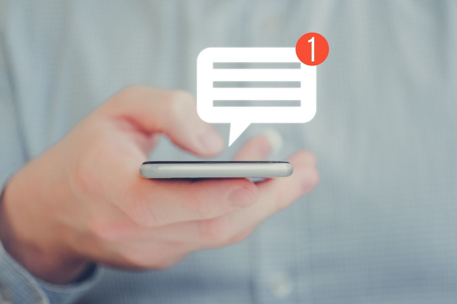 Man checking SMS notification on his phone