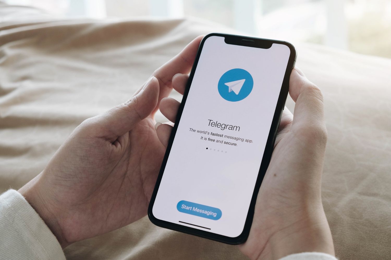 Smartphone with Telegram app opened