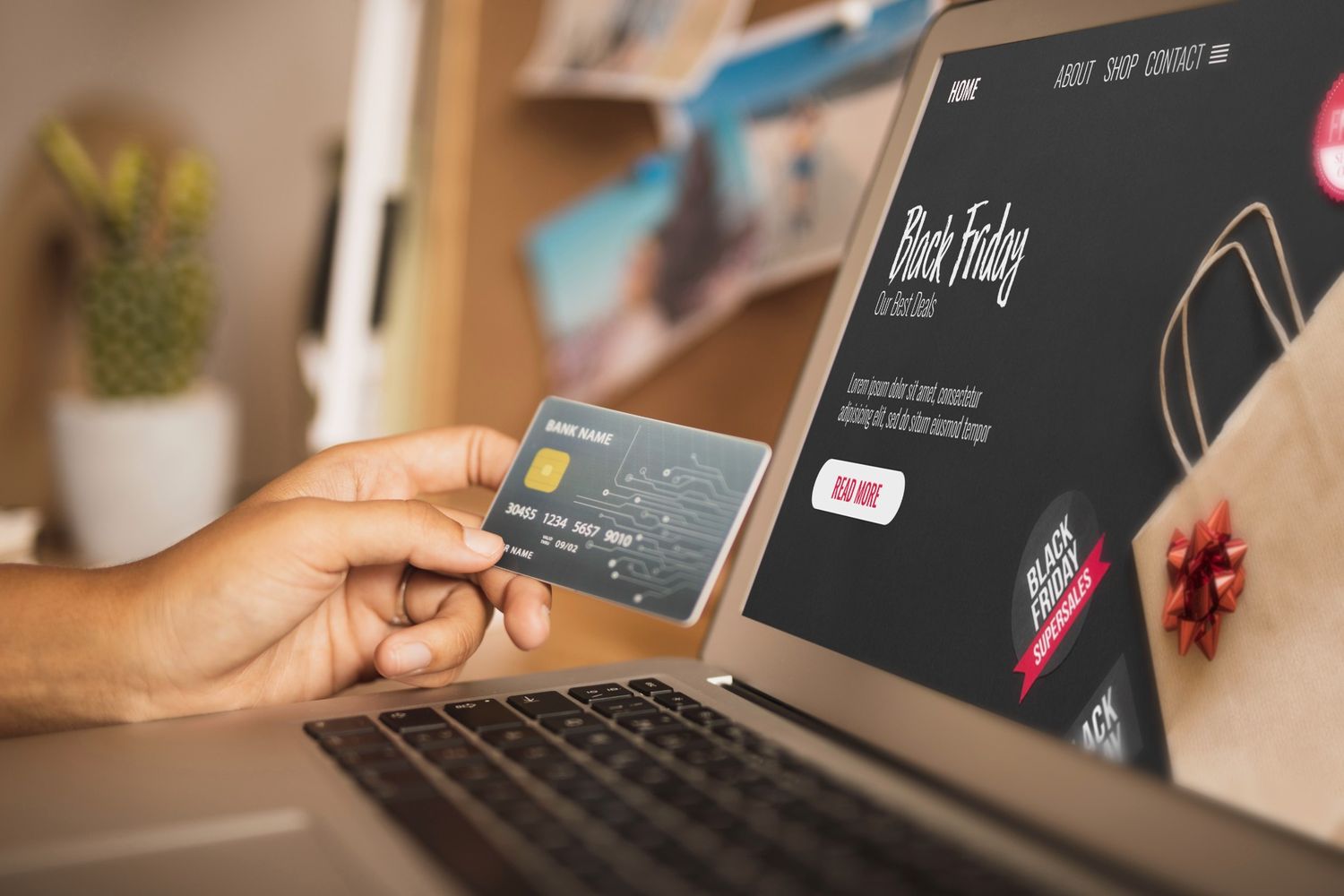 person holding a credit card while shopping online