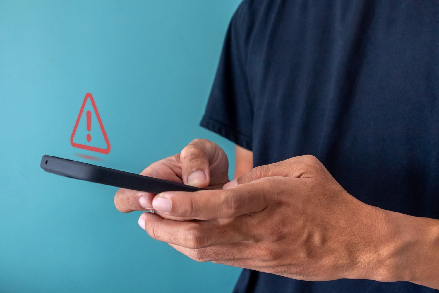 Man holding phone with Telegram scam alert